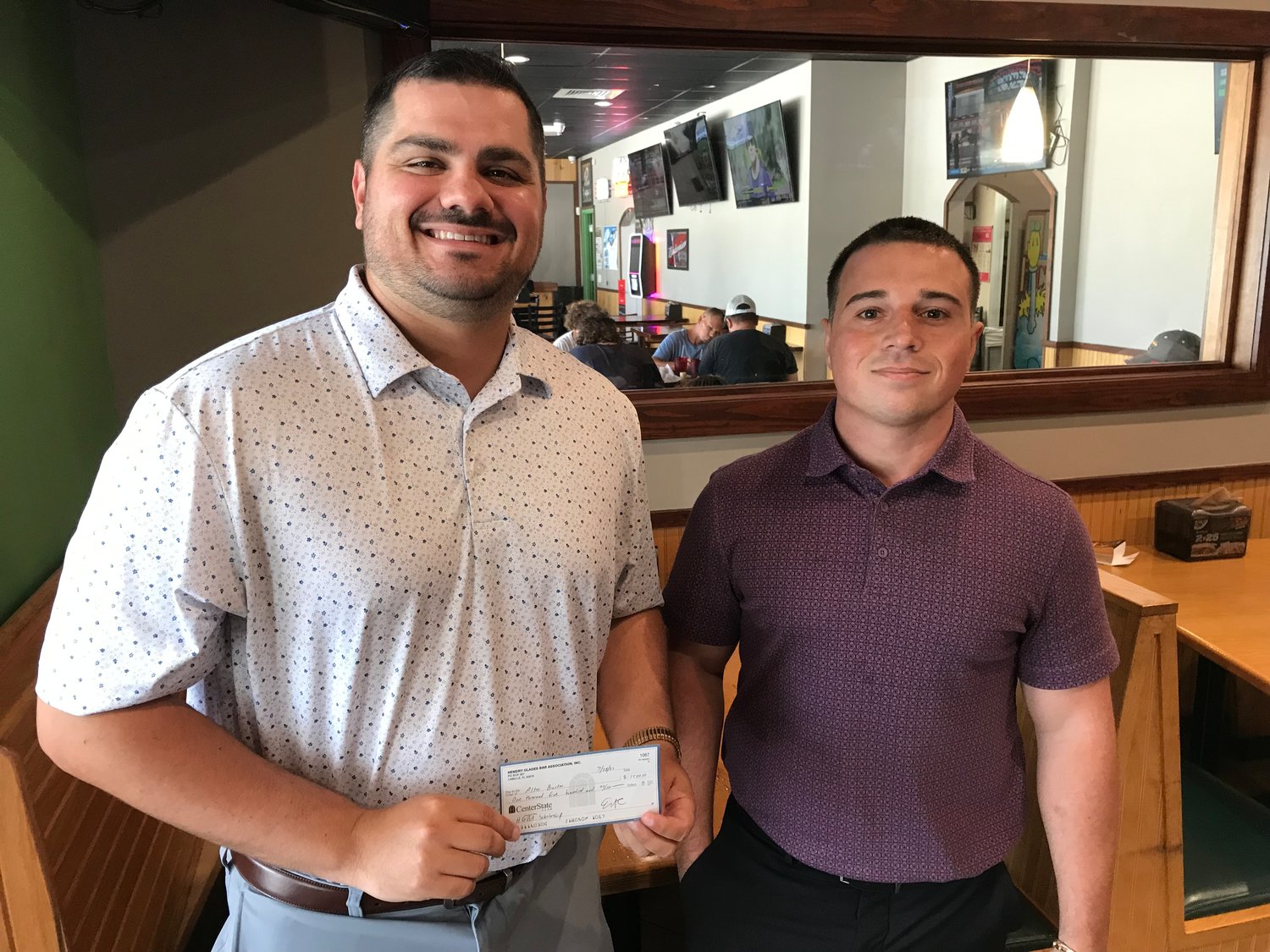 Alton Burton (left) and Scott Morrison (right) each received a $1,500 scholarship on July 28, from The Hendry-Glades Bar Association.